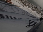 snow and structures in a hillside